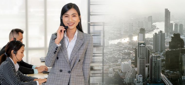 Business people wearing headset working in office to support remote customer or colleague. Call center, telemarketing, customer support agent provide service in broaden view .