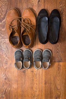 Shoes for the entire family on the floor