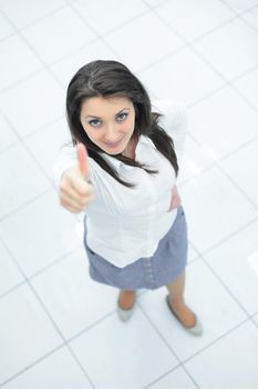 view from the top.in full growth.successful business woman showing thumb up. photo with copy space.