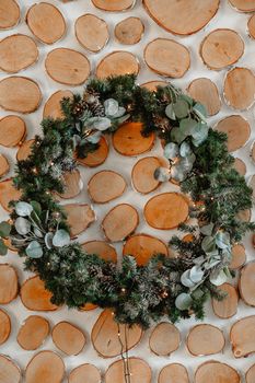 Green Christmas wreath hanging on the wall