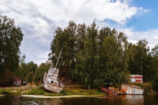 An old rusty military ship, stranded.