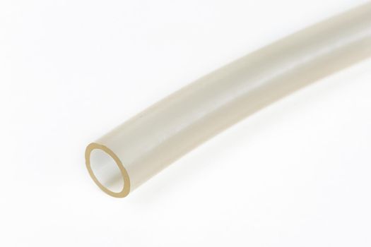 The cut tip of the rubber hose, on a white background.