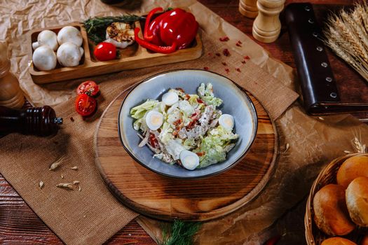 salad with quail eggs and dried tomatoes.