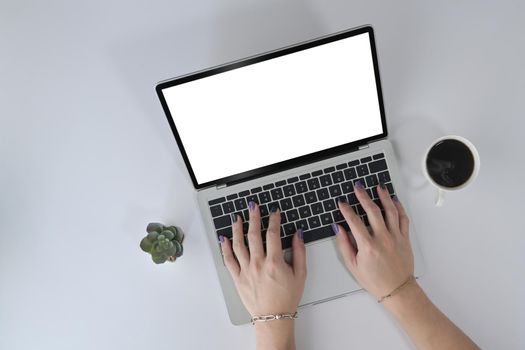 Above view woman hands typing on laptop computer keyboard.