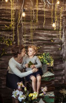 happy mother and little daughter on the background of country house