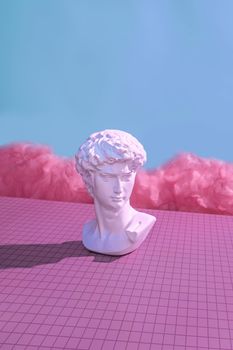 Michelangelo's David in the virtual cyberpunk metaverse. Minimal concept of future and digital innovation in pastel color trend color.