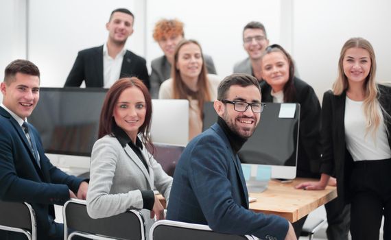 close up. a group of successful young employees in the workplace in the office