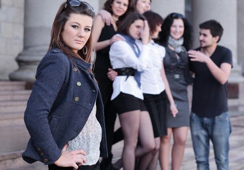 girl student on the background of the team of friends .photo with copy space