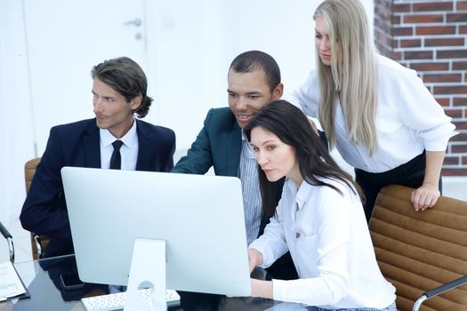 business people discussing financial information,sitting at his Desk.the concept of teamwork