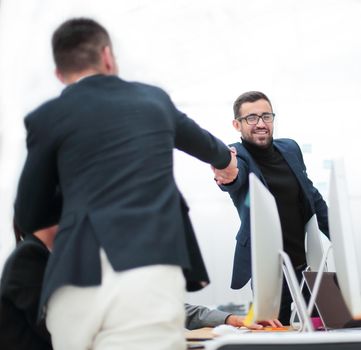 business people shaking hands at a work meeting. photo with copy space