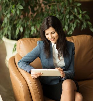 Beautiful business woman. View very important documents.