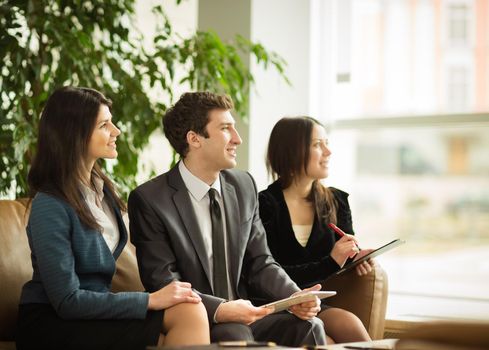 A group of successful businessmen. Discussion of the important contract of the company.