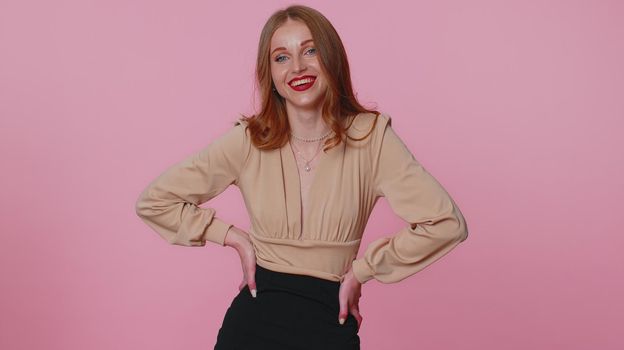 Cheerful beautiful businesswoman student girl in beige blouse smiling and looking at camera. Young fashion lovely model woman indoors studio shot isolated on pink wall background. Female nature beauty