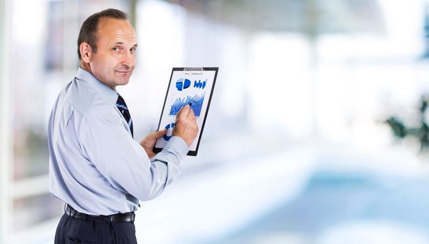 Confident businessman in office.