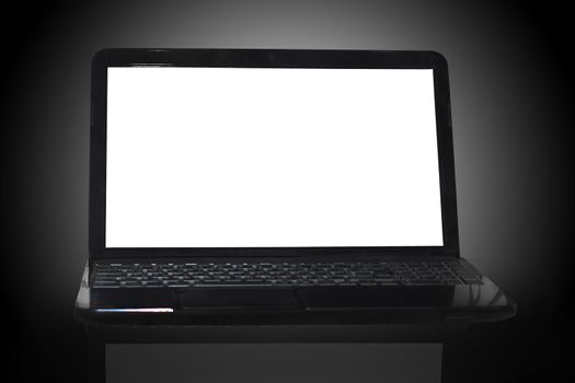 black laptop on black background with reflection