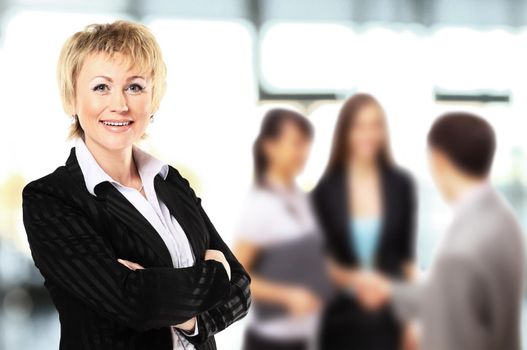 Successful business woman looking confident and smiling