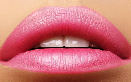 Sweet kiss. Perfect natural pink lip makeup. Close up macro photo with beautiful female mouth. Plump full lips. Close-up face detail. Perfect clean skin, light fresh lip make-up