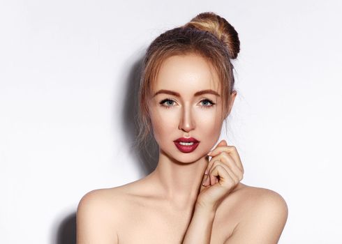 Blow sweet kiss. Beautiful woman with fashion red lips make-up on white background. Valentines day Makeup. Sexy look