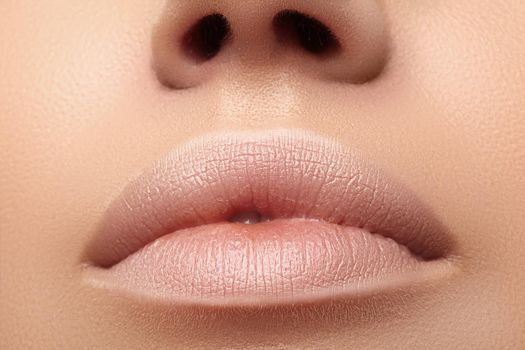 Moisturizing lip balm, lipstick. Close-up of a beautiful lips. Nice full lips with lip makeup. Filler Injections, Plastic Surgery, Collagen and Treatments