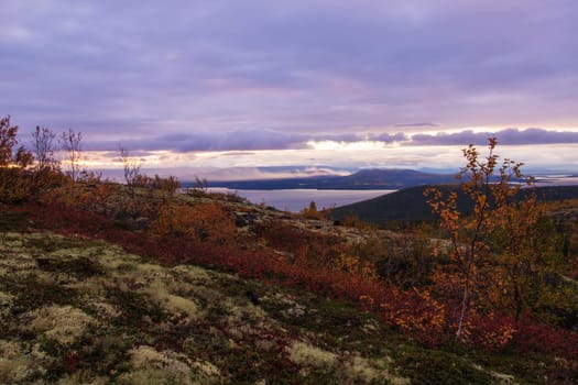 North Russia Khibiny mountains in autumn mountain lake and forest. Murmansk region. photo