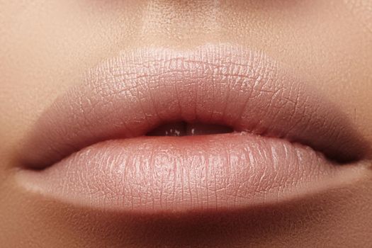 Moisturizing lip balm, lipstick. Close-up of a beautiful sexy lips. Nice full lips with lip makeup. Filler Injections, Plastic Surgery, Collagen and Treatments