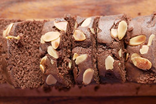 slice of bakery cake on chopping board on white .