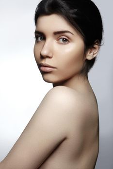 Beautiful face of young woman. Skincare, wellness, spa. Clean soft skin, healthy fresh look. Natural daily makeup.
