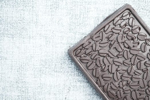 dark chocolate on a plate on table close up .