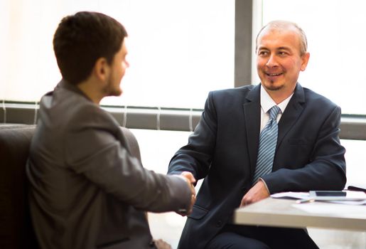 Business people shaking hands, finishing up a meeting