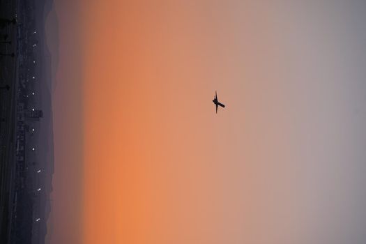 airplane silhouettes isolate on a red background at sunset. high quality photo