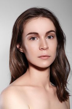 Beauty Woman Face Portrait. Beautiful Spa Model Girl with Perfect Fresh Clean Skin. Youth and Skin Care Concept.