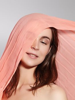 Happy Girl. Natural Make-up and Accessories. Beautiful Romantic Style of Young Woman with Waving Silk Scarf. Tender Light Fabric