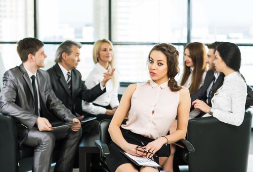 A group of businessmen discussing the policy of the company in the office.