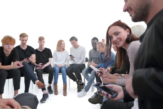 close up. diverse young people using their smartphones. photo with copy space