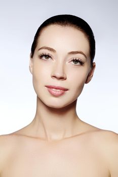 Beautiful face of young woman. Skincare, wellness, spa. Clean soft skin, healthy fresh look. Natural daily makeup.