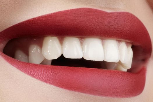 Beautiful smile with whitening teeth. Dental photo. Macro closeup of perfect female mouth, lipscare rutine.