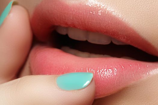 Face part. Beautiful female lips with natural makeup, clean skin. Macro shot of female lip, clean skin. Fresh kiss. Spa beauty cosmetics.