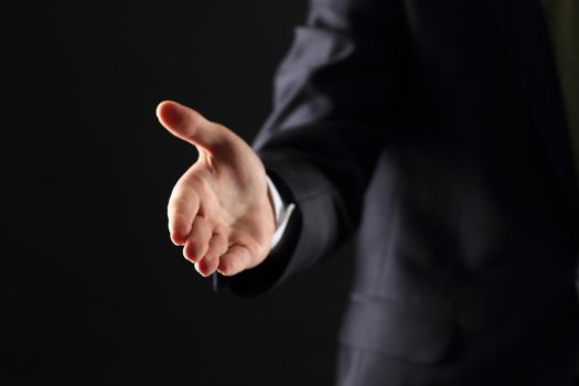 A business man with an open hand ready to seal a deal