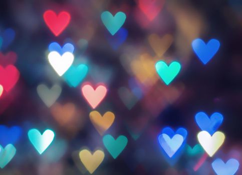 glowing colorful hearts in the form of bokeh. photo