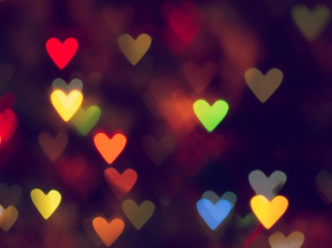 glowing colorful hearts in the form of bokeh. photo