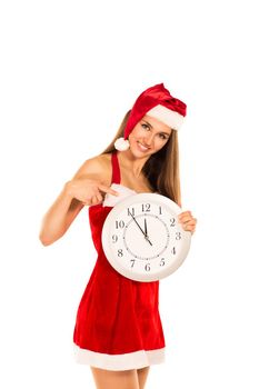 Pretty Woman In Santa Claus Costume Showing Clock Over white Background