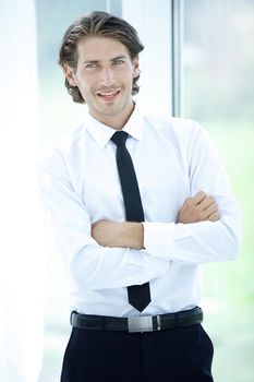 closeup.portrait of successful businessman on background of office