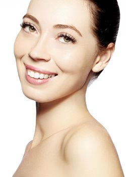 Beautiful face of young woman. Skincare, wellness, spa. Clean soft skin, healthy fresh look. Natural daily makeup. Happy smiling woman