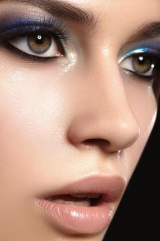 Closeup portrait with of beautiful woman face. Fashion makeup, clean shiny skin. Makeup and cosmetic. Beauty style on model face