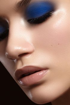 Closeup portrait with of beautiful woman face. Fashion makeup, clean shiny skin. Makeup and cosmetic. Beauty style on model face