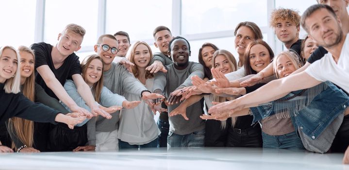 multinational group of young people joining their palms. photo with copy space