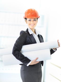 young female engineer with a roll of drawings