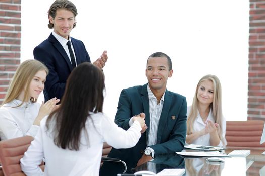 business team applauding business partners after signing the contract.the concept of cooperation