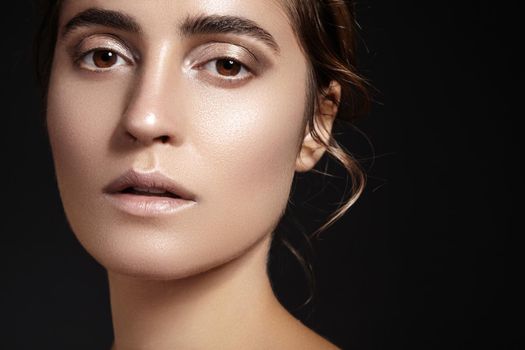 Beautiful face of young woman. Skincare, wellness, spa. Clean soft skin, healthy fresh look. Natural daily makeup.