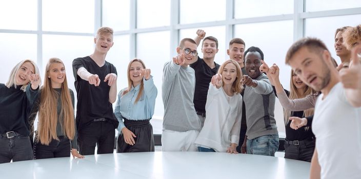 multinational group of students standing near a round table. photo with copy space